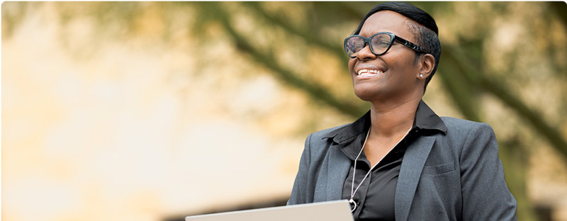 A confident professional who is prepared and excited for work.