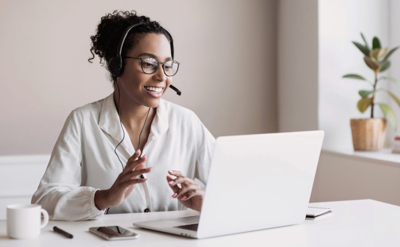 Technical support staff helping a student online