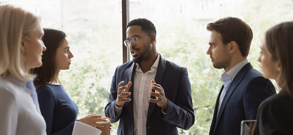 Business professionals discussing ideas in a modern office setting