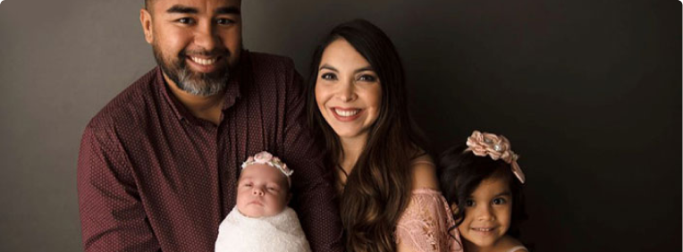 A graduate of University of Phoenix with his family.