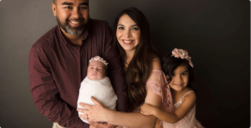 A graduate of University of Phoenix with his family.
