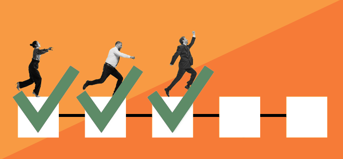 Business men jumping on check marked boxes to represent how to use task management