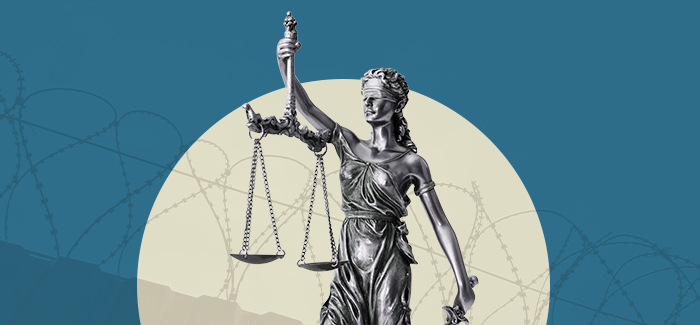 A statue to represent justice and a detention officer