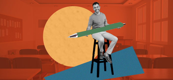 Male teacher who uses experiential learning style in his curriculum sitting on a stool holding an oversized pen