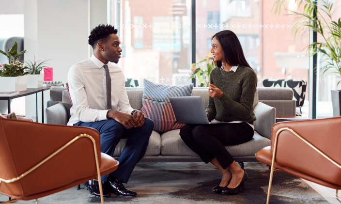 Man and woman interviewing casually on a couch