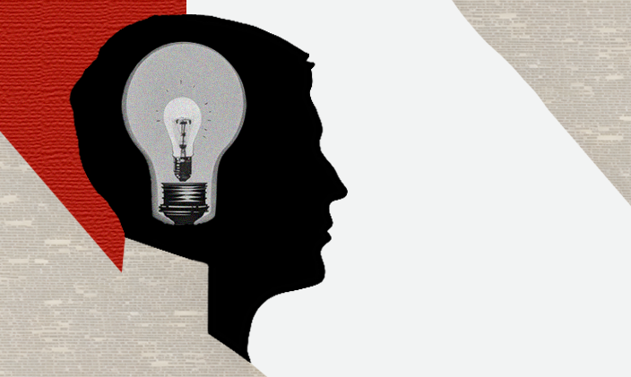 Lightbulb in the brain of a side profile of a dean