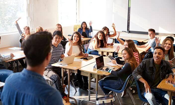 Teacher giving a lesson in classroom using constructivist learning theory