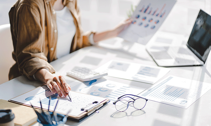 Financial planner looking through finance data