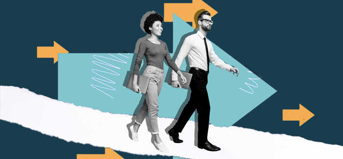 Two working professionals walking side by side to represent what is leadership in hr