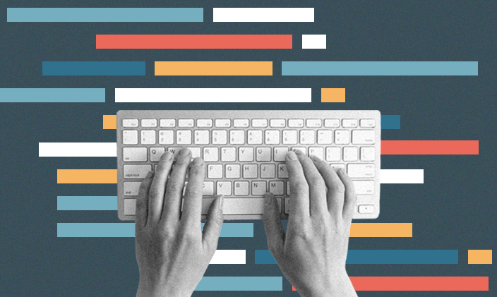 Hands typing at a keyboard learning to code