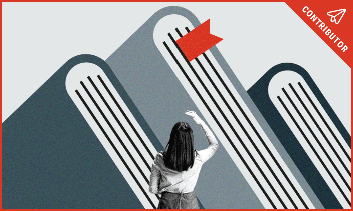 a woman looking up at a stalk of books to signify the benefits of college education