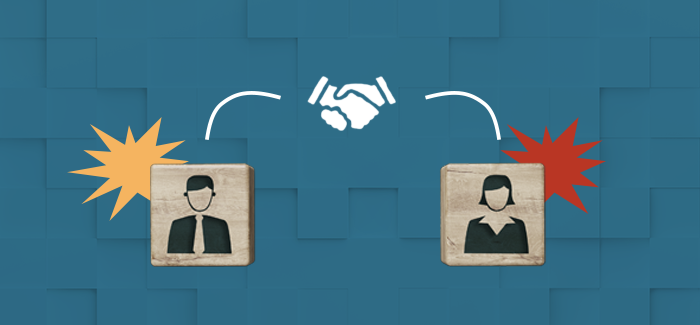 A male and female employee block shaking hands to signify employee relations manager