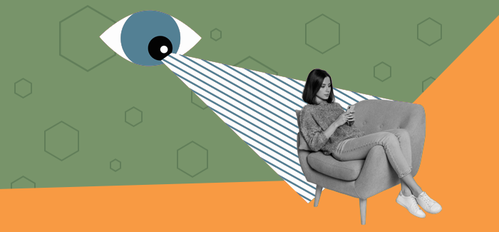 Woman sitting on a chair scrolling on her phone with a huge eye in the background to represent cyberpsychology