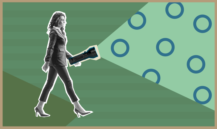 Business woman with a flashlight to indicate leading the  to signify types of management styles