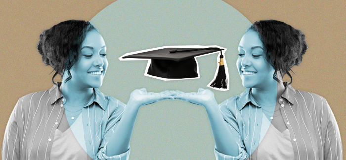 Smiling woman holding a graduation cap