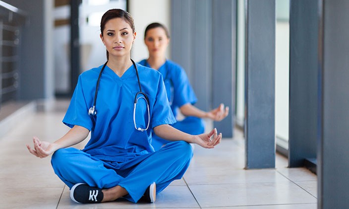 Nurses practicing mindfulness to relieve stress at work.