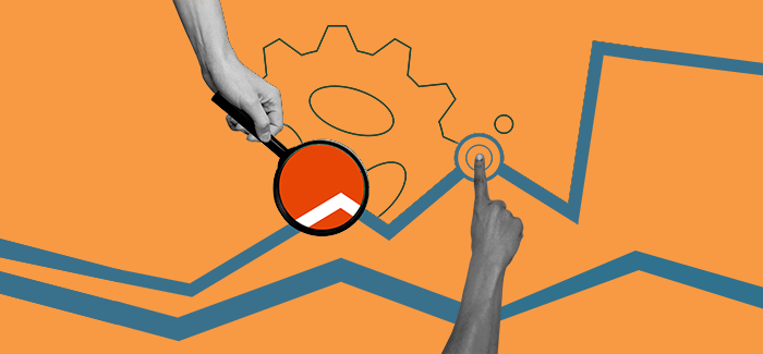 A hand holding a magnifying glass and another pointing to a map to signify strategic planning