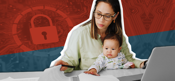 A working mother with her baby on her lap in front of a laptop reviewing cybersecurity tips for remote workers