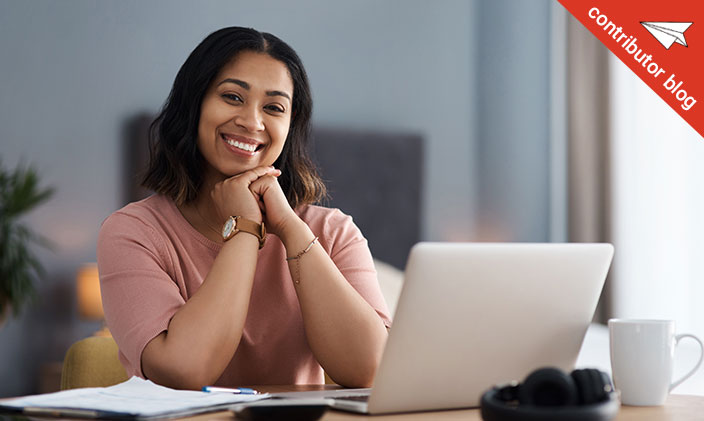 A woman smiles in a virtual meeting