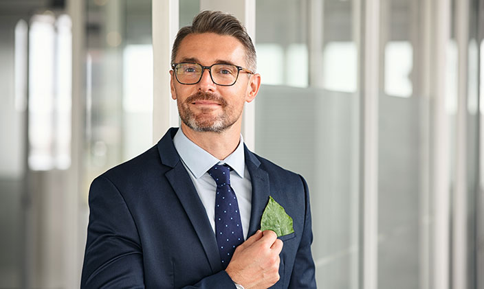 Man in suit and tie, smiling 