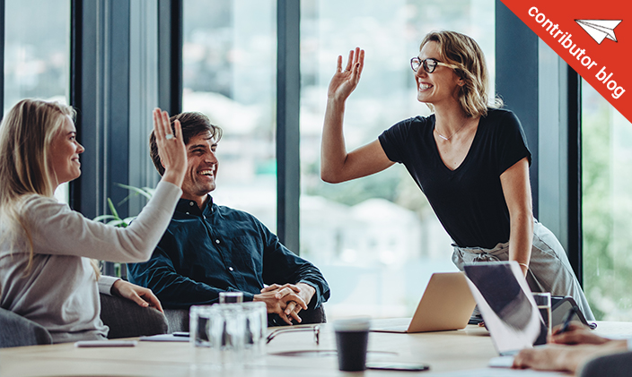 Woman high fiving her co-worker