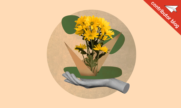 A hand holding flowers