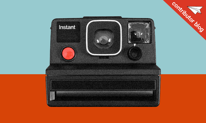 Polaroid camera on blue and orange background