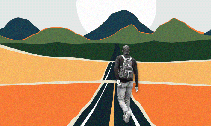 A student walking down a road