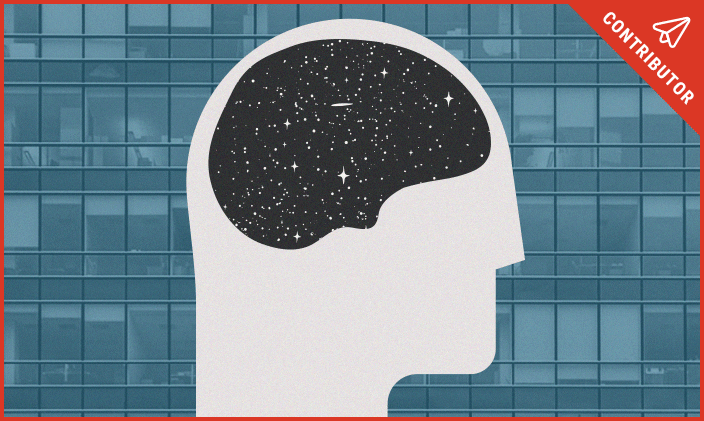 Silhouette of a face and stars inside a silhouette of a brain