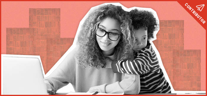 A smiling mother sits at her laptop, bringing her mom skills to college, as her child hugs her