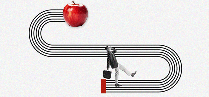 Older male student with briefcase walking toward an apple to signify earning college credit for life and work experience