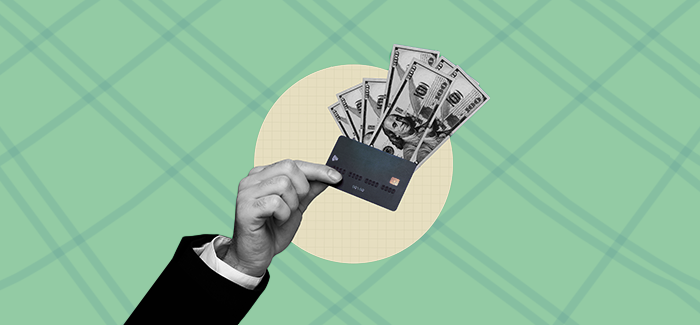 A hand  holding out money to signify comparison shopping