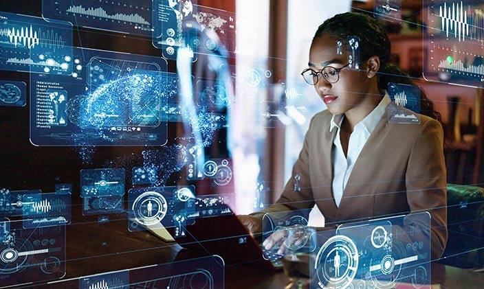 Network security analyst uses a laptop to find and fix potential security issues