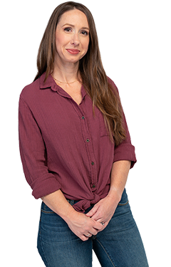 Woman smiling with her hands crossed in front