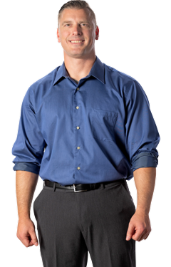 man in office clothes smiling
