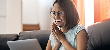 A woman about to apply to the University of Phoenix on her laptop