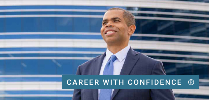 A smiling University of Phoenix graduate faces his future confidently.