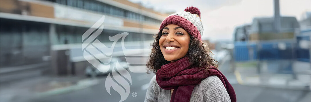 A smiling student bundled up for winter 