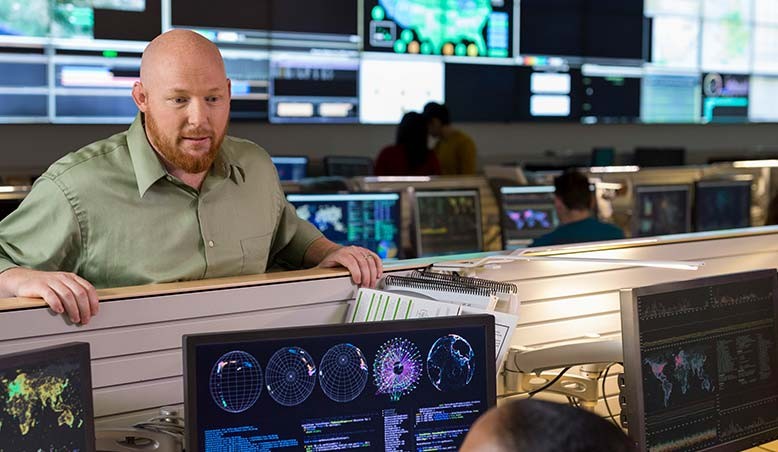 Computer science professional works with a colleague in the field