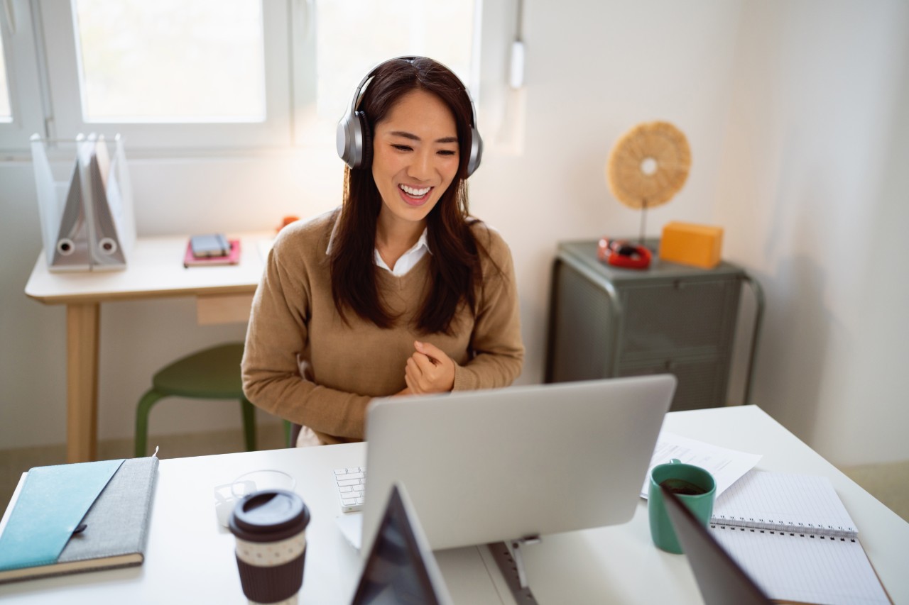 Student happy to be attending class via videoconference