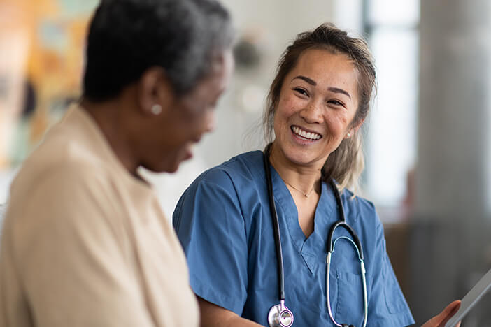 Nursing student encouraging a patient