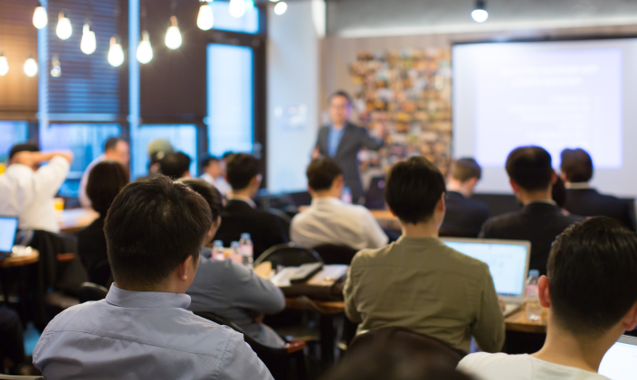 classroom lecture viewed from back of room