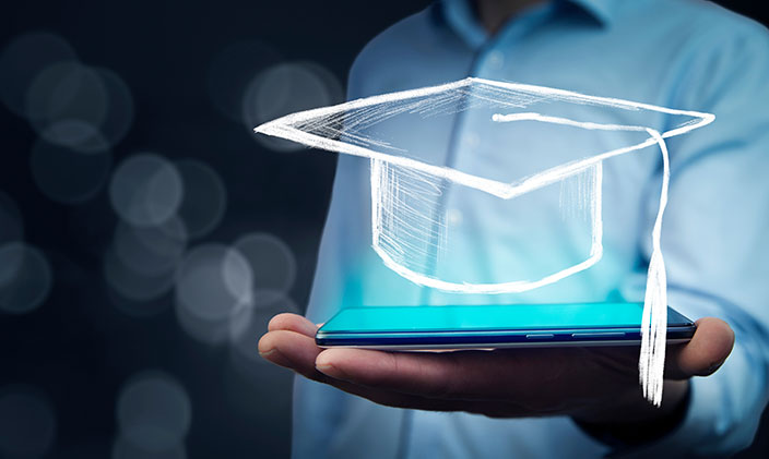 Animated graduation cap floating above smart phone in someone's palm