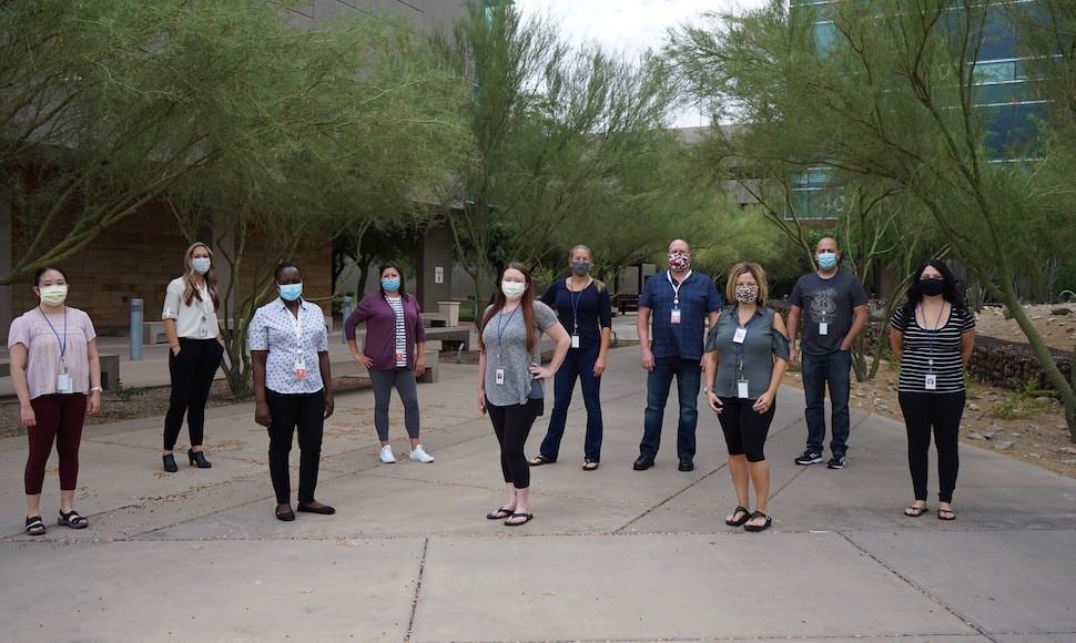 Nursing residents pose outdoors