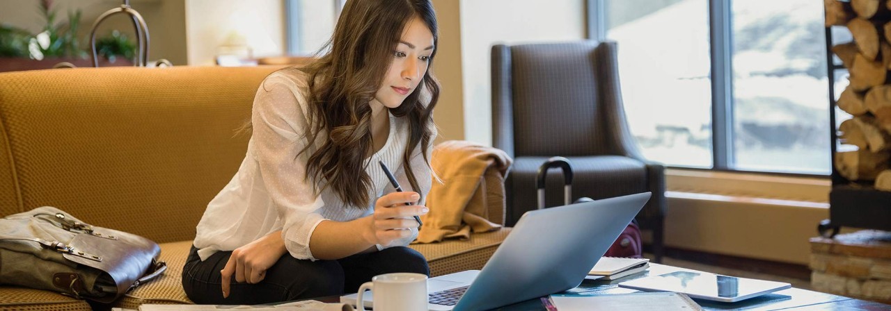 student doing schoolwork on a laptop