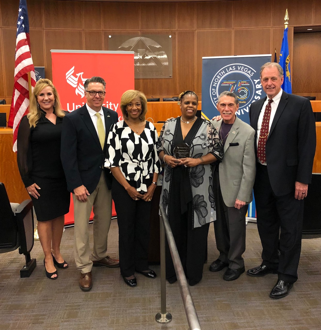 Lauri Perdue, campus & academic director of University of Phoenix, North Las Vegas City Councilman Scott Black, North Las Vegas City Councilwoman Pamela Goynes-Brown, scholarship recipient LaGeisha Espy, Mayor Pro Tem Richard Cherchio, and Mayor John Lee.