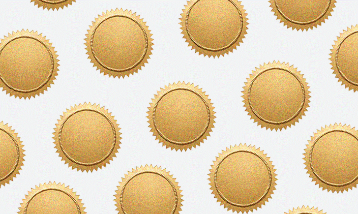 Frame is filled with gold medals against a white background.