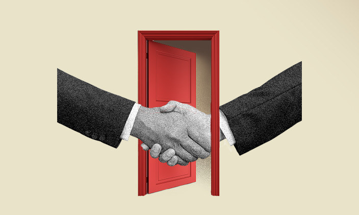 Two hands outstretched in a handshake with a red door open in the background.