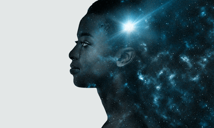 A side profile of a woman's face looking left with a light reflecting off her representing emotional intelligence and organizational wellness.