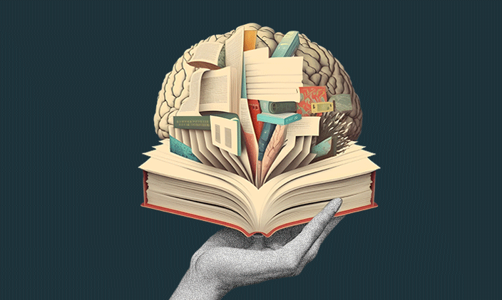 A hand holding an open book with a drawing of a brain in the center representing a new white paper on autonomy and workplace burnout.